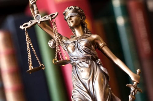A statue of lady justice holding the scales.